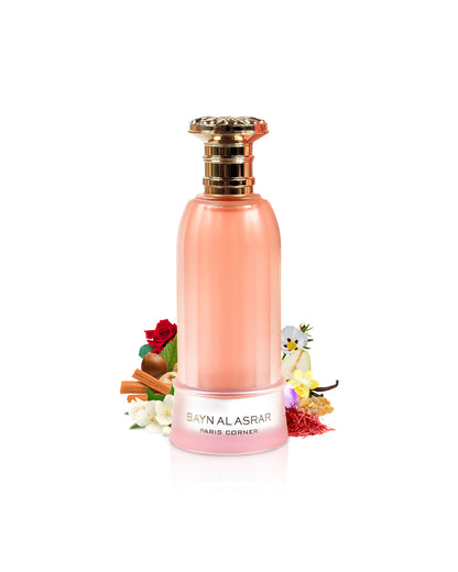 paris corner bayn al asrar perfume bottle surrounded with its fragrance notes like jasmine and saffron shows from behind the bottle against white background