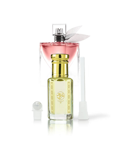 belle aura erfume oil bottle beside roller and stick with La Vie Est Belle bottle behind shows against white background
