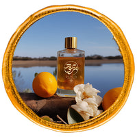 chypre Perfume bottle besides lemon labdanum with lackside on the background