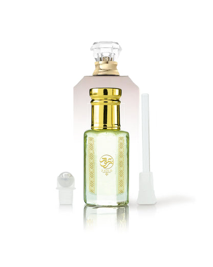 cocotopia perfume oil bottle beside roller and stick with Utopia Vanilla Coco kayali bottle behind against white background