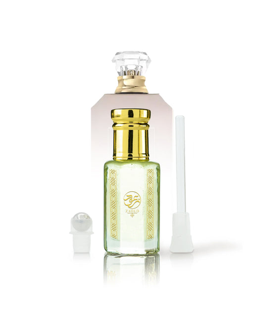 cocotopia perfume oil bottle beside roller and stick with Utopia Vanilla Coco kayali bottle behind against white background