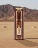lattafa eternal oud deodorant bottle with desert and mountains in the background