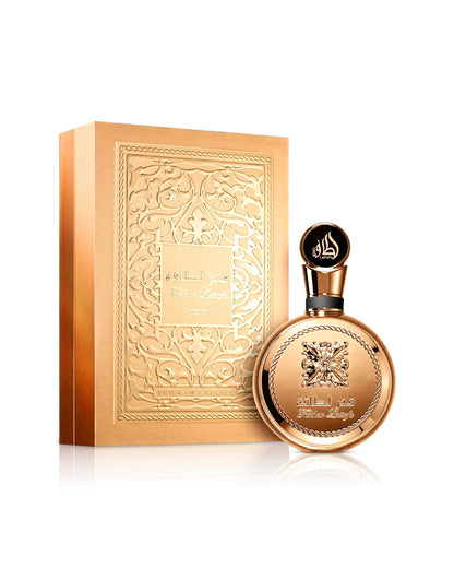 lattafa fakhar gold extrair perfume bottle shows beside its box against white background