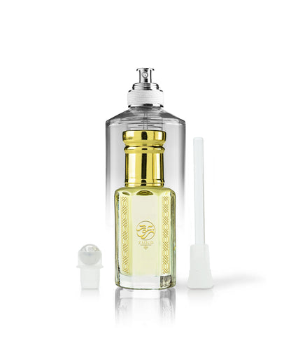 firewood perfume oil bottle beside roller and stick with by the fireplace perfume bottle behind shows against white background