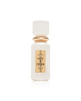 fragrance world cafe n' cream Perfume bottle labeled 'Cafe N' Cream' with textured white design on a white background