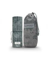 french avenue nomad perfume bottle shows beside its packaging against white background