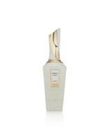 A bottle french avenue spirito mystic, featuring a frosted off-white bottle with a metallic gold cap and a gold-bordered label, set against a plain white background.