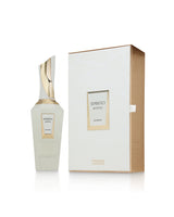 A bottle of french avenue spirito mystic perfume spray stands next to its elegant white and gold packaging box on a clean white background.