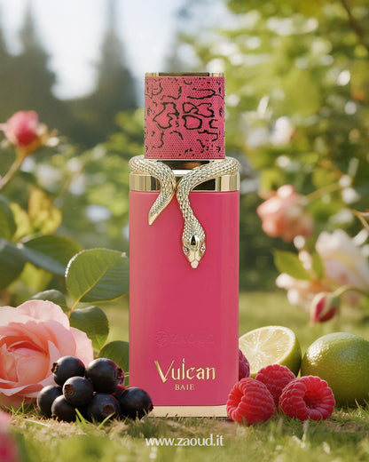 A bold pink perfume bottle named ‘Vulcan Baie’ by Fragrance World, crowned by a pink snakeskin-patterned cap. Surrounded by fresh raspberries, blackcurrants, limes, against a lush garden backdrop.