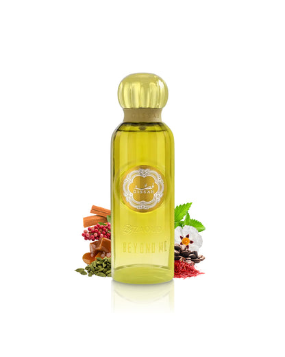 gissah beyond me fragrance bottle with a yellow cap and golden-yellow liquid, styled with botanical ingredients like cinnamon, cloves, and a white flower on a white background.