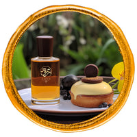 gourmand Perfume bottle beside vanilla creamy desert