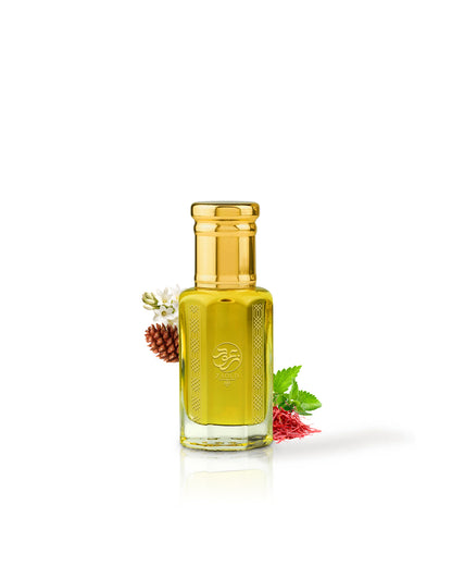 Gozal perfume oil bottle filled with golden yellow liquid, topped with a shiny gold cap, set against a solid white background with small botanical accents including a pinecone, white flower, green leaves, and red berries.