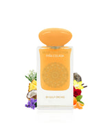 Perfume bottle labeled 'Pina Colada' by Gulf Orchid with decorative elements like orange and pineapple on a white background