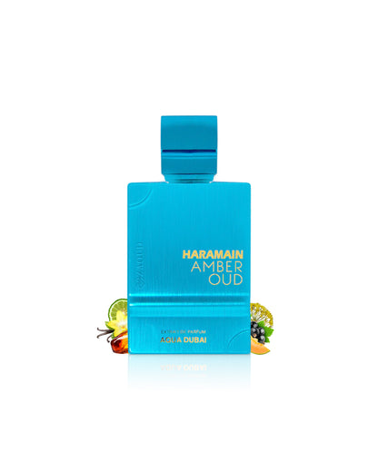 haramain amber oud aqua dubai perfume bottle surrounded with fragrance notes like amber and orange shows against white background