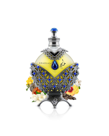 hareem al sultan antique blue perfume oil by khadlaj perfume bottle surrounded with its ingredients like jasmine and citrus with many others shows from behind the bottle against white background