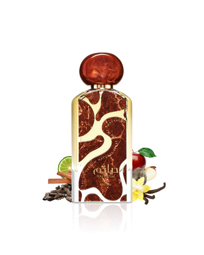 hayaatim by lattafa perfumes bottle surrounded with its ingredients like apple and vanilla with many others shows from behind the bottle against white background