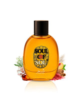 A bottle of Soul of Sol by hekayat attar with amber-colored liquid, a black cap, and a decorative label, styled with small flowers, cinnamon sticks, and pink petals on a white background.