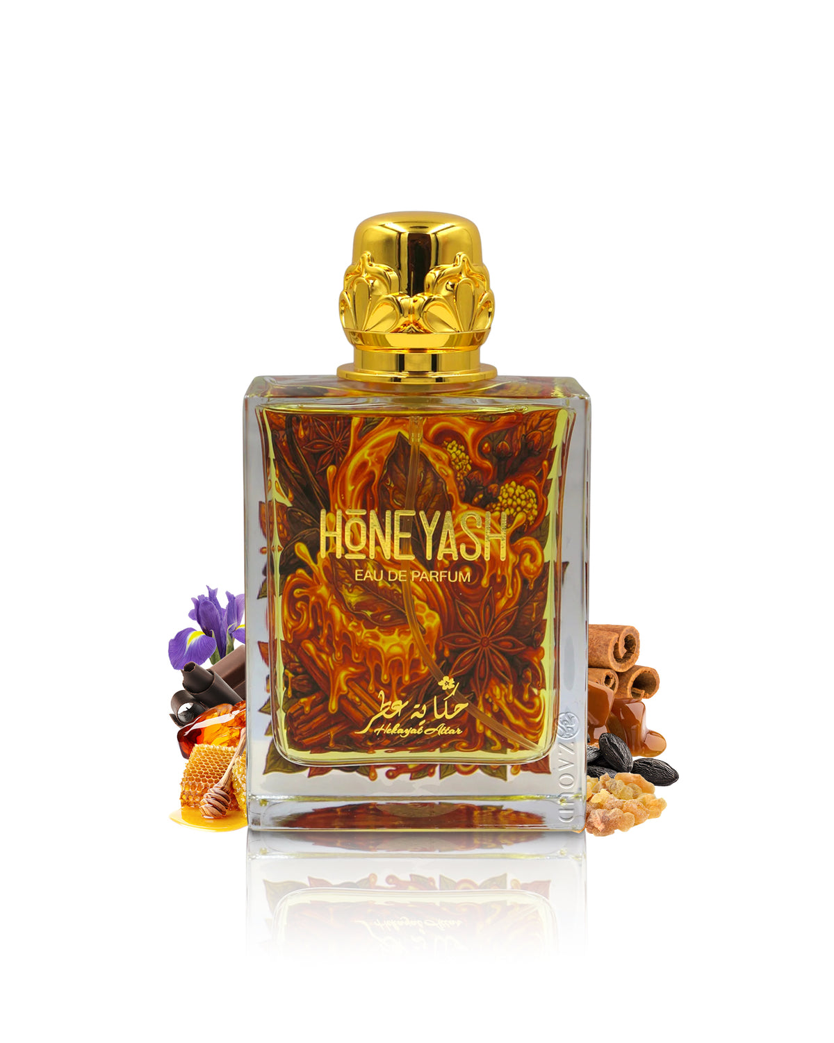 hekayat attar honeyash perfume bottle surrounded with fragrance notes like honey and spices shows against white background