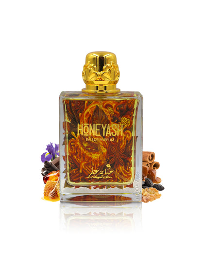 hekayat attar honeyash perfume bottle surrounded with fragrance notes like honey and spices shows against white background