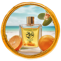 hesperidic perfume bottle surrounded by grapefruits infront of beach