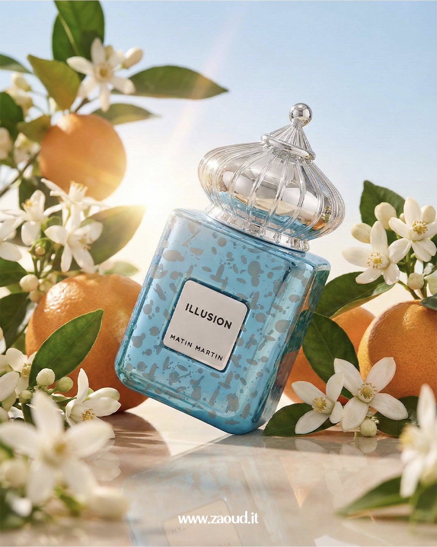 Blue perfume bottle labeled 'Illusion' surrounded by oranges and flowers on a bright background