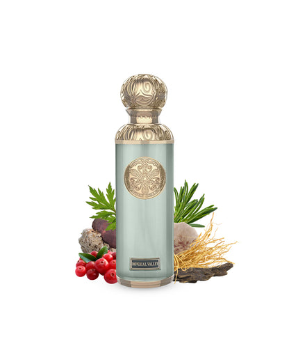 imperial valley by gissah perfume bottle surrounded with its ingredients like oud and ambergris with many others shows from behind the bottle against white background