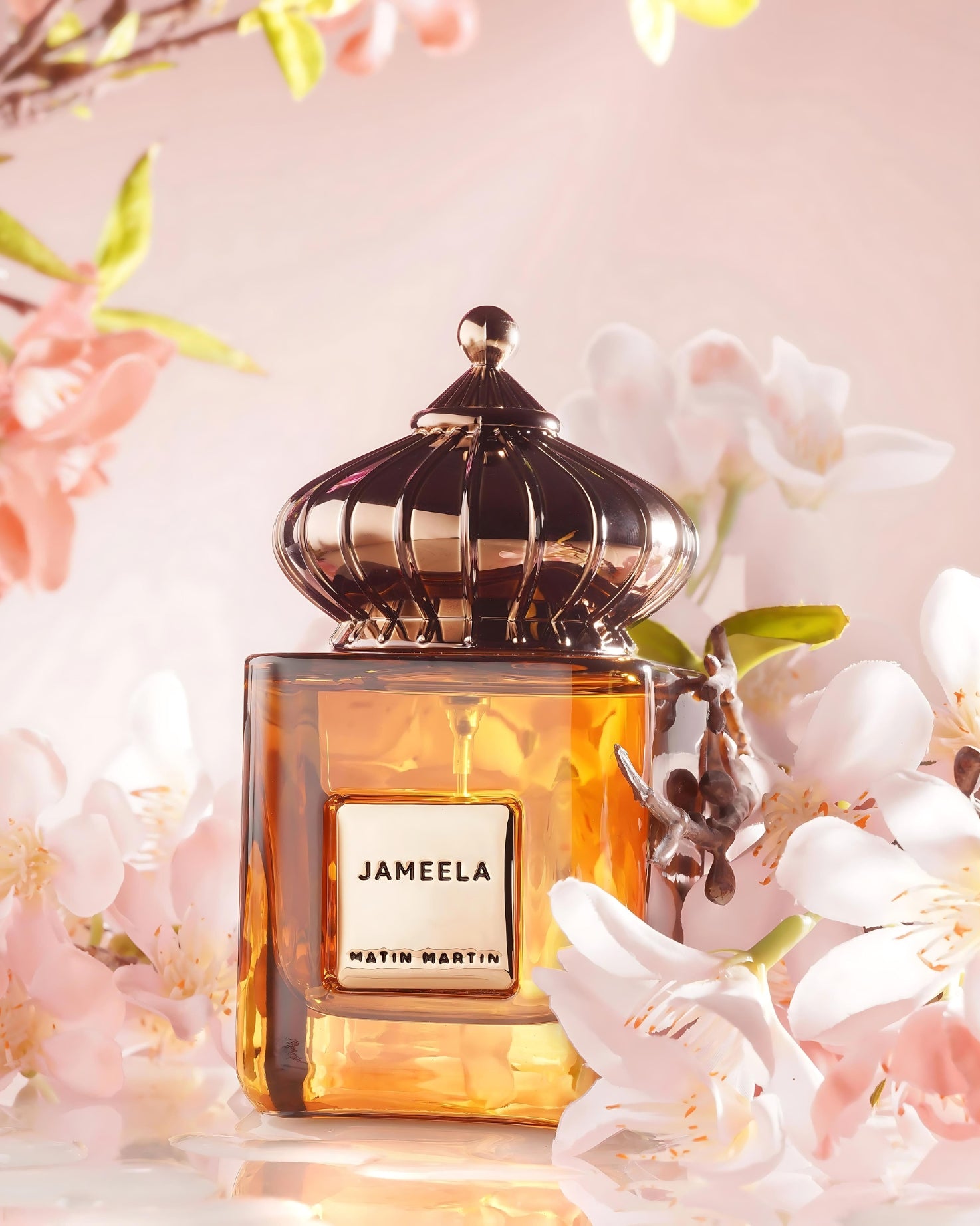 Perfume bottle labeled 'Jameela' by Matin Martin with floral background
