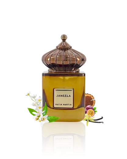 Matin martin jameela Perfume bottle with decorative elements like jasmine and vanilla on a white background