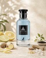Jean Lowe Fantasme perfume bottle with lemons, ginger, and other ingredients on a light background