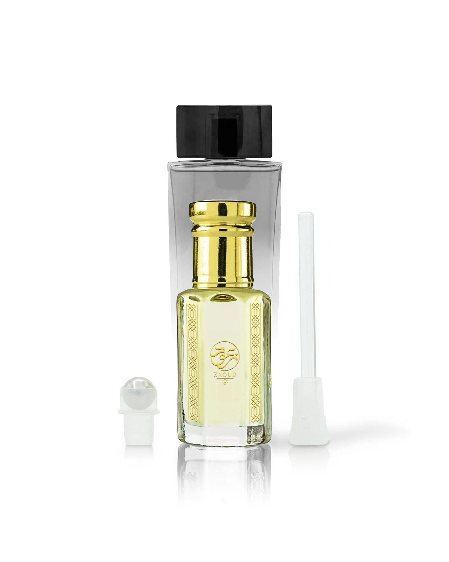 kaleema perfume oil bottle with golden cap beside roller and stick with kalemat perfume bottle behind against white background