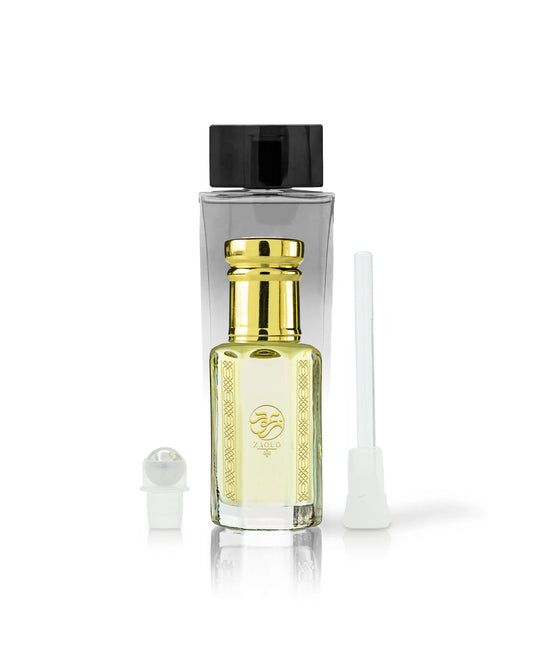 kaleema perfume oil bottle with golden cap beside roller and stick with kalemat perfume bottle behind against white background