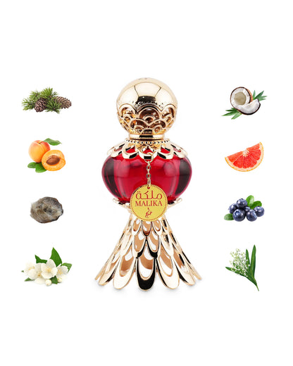 khadlaj malika red perfume oil bottle surrounded with its ingredients like peach and coconut shows from behind the bottle  against white background