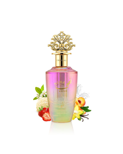 khadlaj nuha bon bon perfume bottle surrounded by fragrance notes like strawberry and vanilla shows against white background