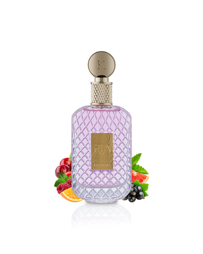 khadlaj ria perfume bottle surrounded by fruits  shows against white background