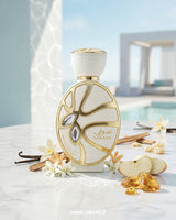 Elegant Khadlaj Sawaar Vanille Blanc perfume bottle surrounded by vanilla pods, apple slices, white florals, cinnamon, and amber resin showcasing a creamy vanilla cashmere gourmand scent.