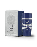 lattafa asad zanzibar limited edition perfume bottle shows beside its packaging against white background