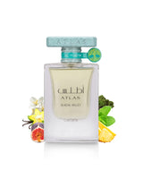 A clear rectangular perfume bottle lattafa ATLAS GLACIAL VALLEY, filled with pale yellow liquid, centered on a white background with decorative flowers, fruit, and mint leaves around it. The bottle has a pale blue cap and a small green-and-yellow tag attached near the neck.