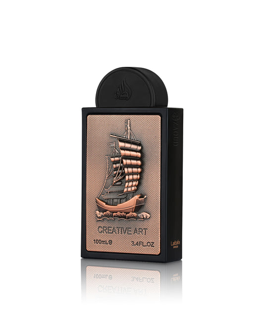 lattafa Creative Art Eau de Parfum, featuring a black rectangular box with a textured rose gold front panel depicting a detailed sailing ship, and a matching black cap on a reflective white background.