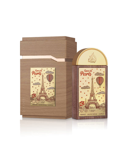 lattafa love in paris perfume bottle shows beside packaging against white background 