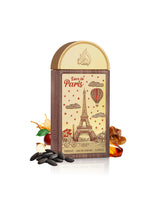lattafa love in paris perfume bottle surrounded by apple and caramel  shows against white background