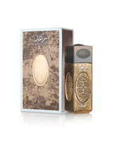 lattafa Raghad Eau de Parfum bottle and its matching retail box, both featuring a textured metallic gold and brown design with a central cream-colored oval motif, set against a clean white background.