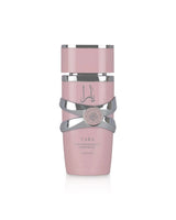 lattafa yara Pink perfume oil bottle and gray cylindrical container with 'Lalique' branding on a white background
