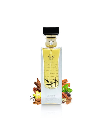 lattafa adeeb perfume bottle surrounded with fragrance notes like spices shows against white background