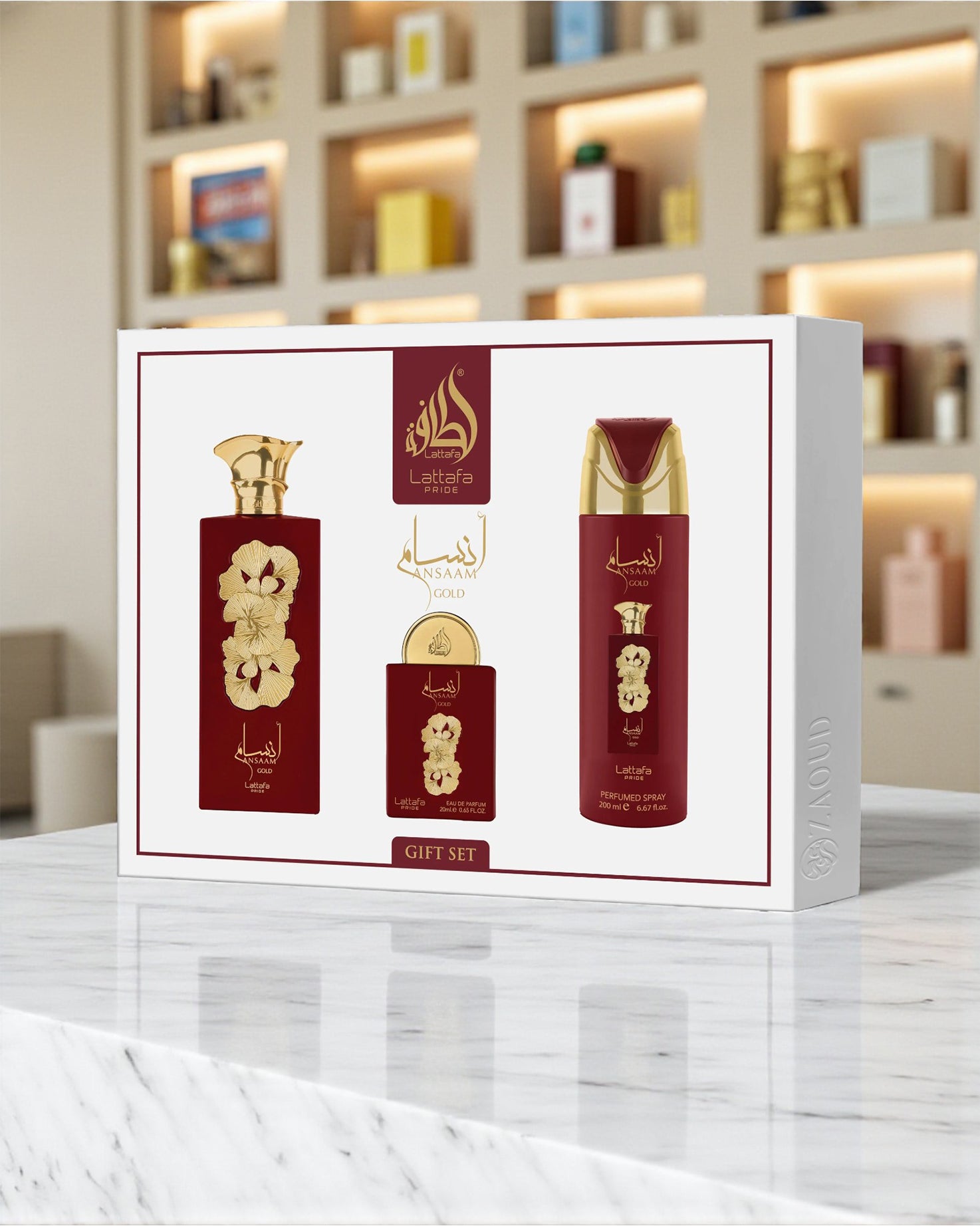 Lattafa ansaam gold gift set packaging on a marble surface with a blurred background