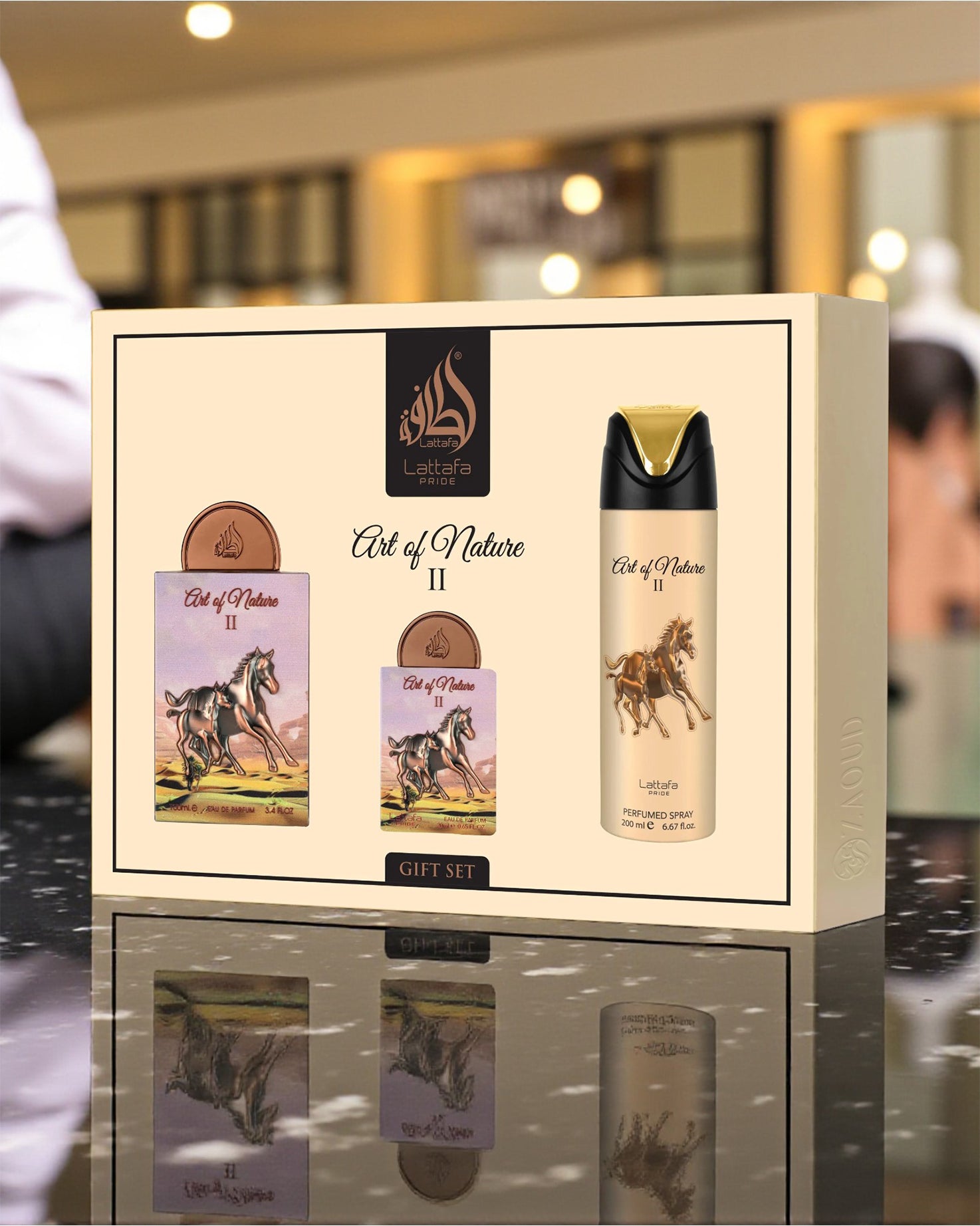 lattafa Art of Nature II gift set with a bottle boxe on a reflective surface.