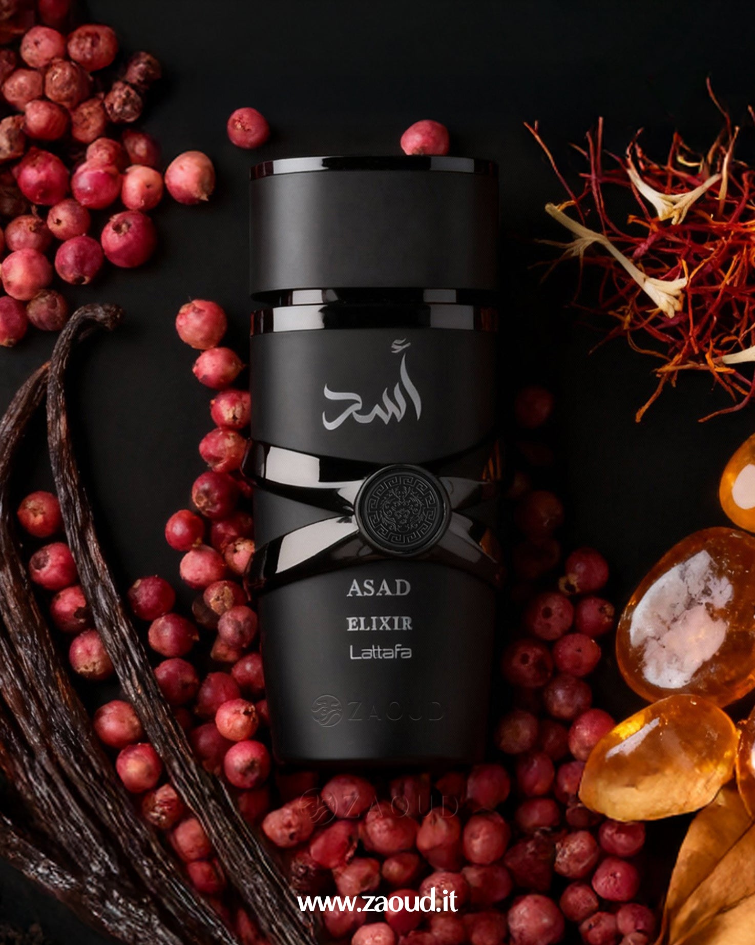 Black bottle of Asad Elixir Lattafa surrounded by red berries and vanilla beans on a dark background