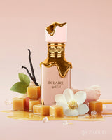 lattafa eclaire perfume bottle photograph beside creamy caramel and honey at ground with jasmine against pink background