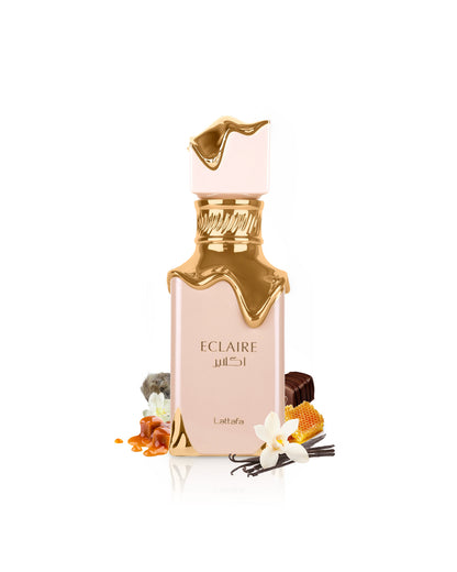 lattafa eclaire perfume bottle surrounded with its ingredients like vanilla an honey with many others like caramel and praline shows from behind the bottle against white background