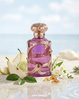 Luxury Lattafa Habik For Women perfume bottle with pear, citrus, white flowers, and amber accents on a soft beach-inspired background representing a fresh floral musk fragrance.