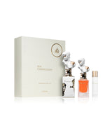 lattafa her confession gift set perfume bottles with packaging behind shows against white background